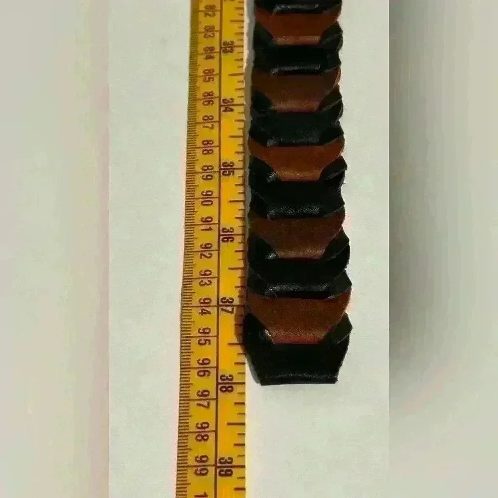 A men’s braided link dress belt with a brass buckle.